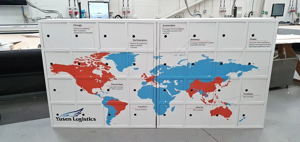 Yusen Logistics printed world-map display with closed doors