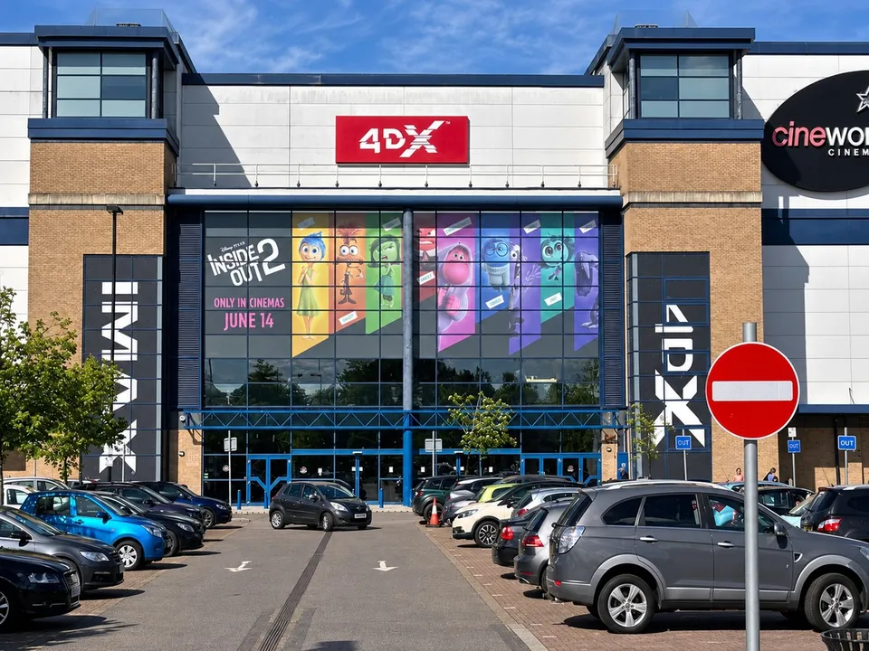 Large-format film campaign graphics within a cinema setting