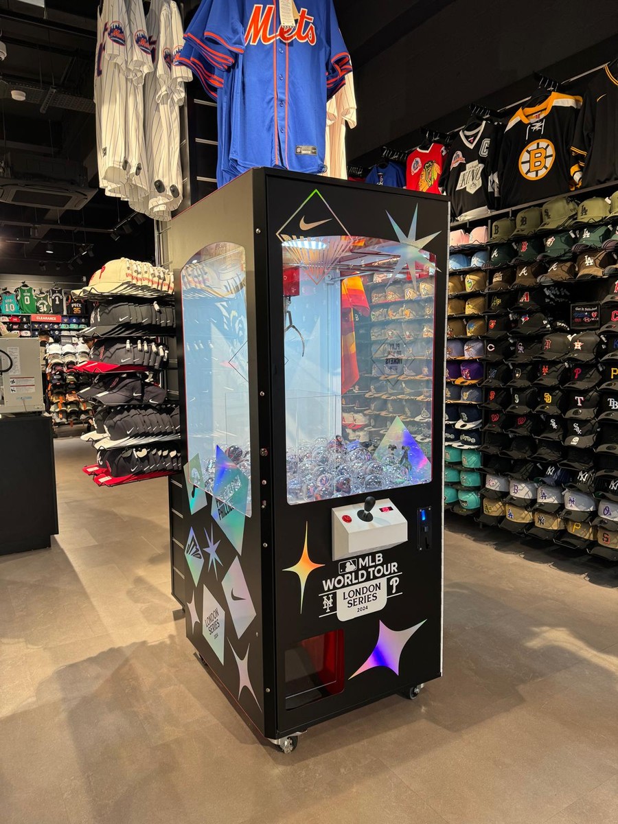 Nike Diamond campaign graphics on a retail claw machine in a sports store