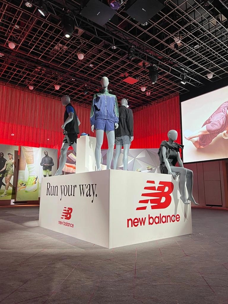 New Balance Run your way branded display platforms with mannequins in an event setting
