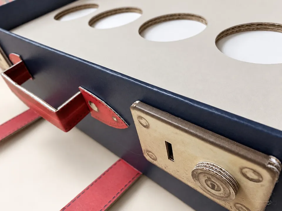 Don Papa suitcase-shaped display with printed straps and corner details