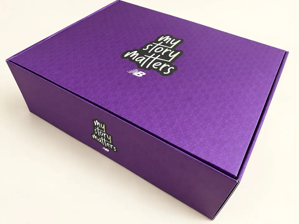 Branded presentation box with printed surfaces