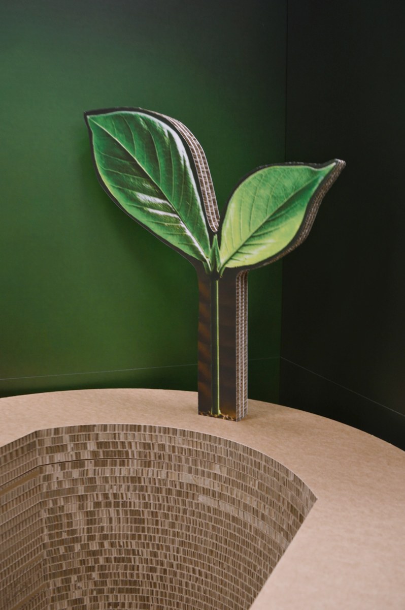 Sculptural chair made from layered board with a decorative leaf