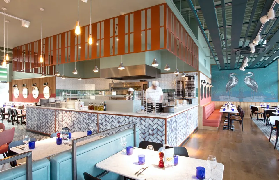 PizzaExpress illustrated heron wall graphics and restaurant setting