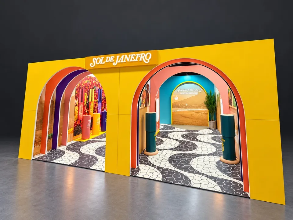 Sol de Janeiro yellow exhibition frontage with layered arches and bold brand lettering