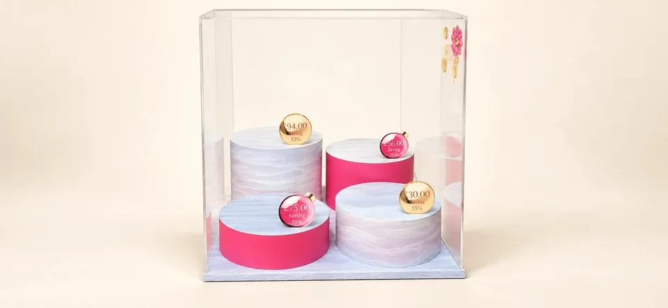 Clarins printed campaign display with pink graphic panels
