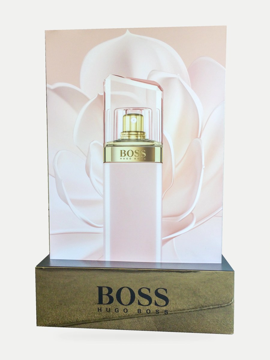 BOSS perfume bottle artwork on a flower-backed display panel