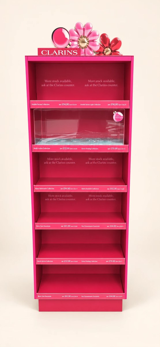 Clarins printed campaign display with pink graphic panels