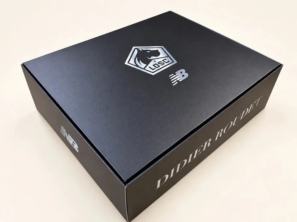 Branded presentation box with printed surfaces