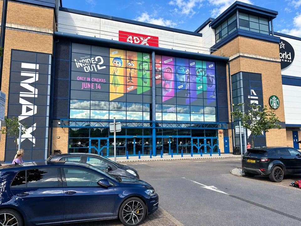 Large-format film campaign graphics within a cinema setting