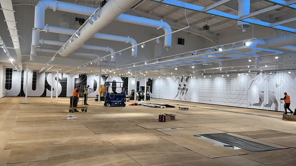 Nike retail interior with oversized campaign lettering