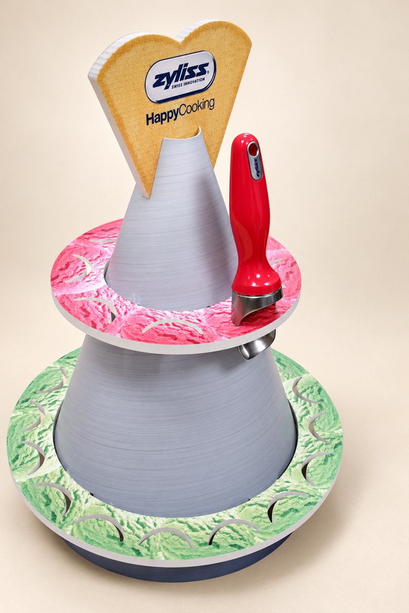 Zyliss two-tier display with a red kitchen utensil