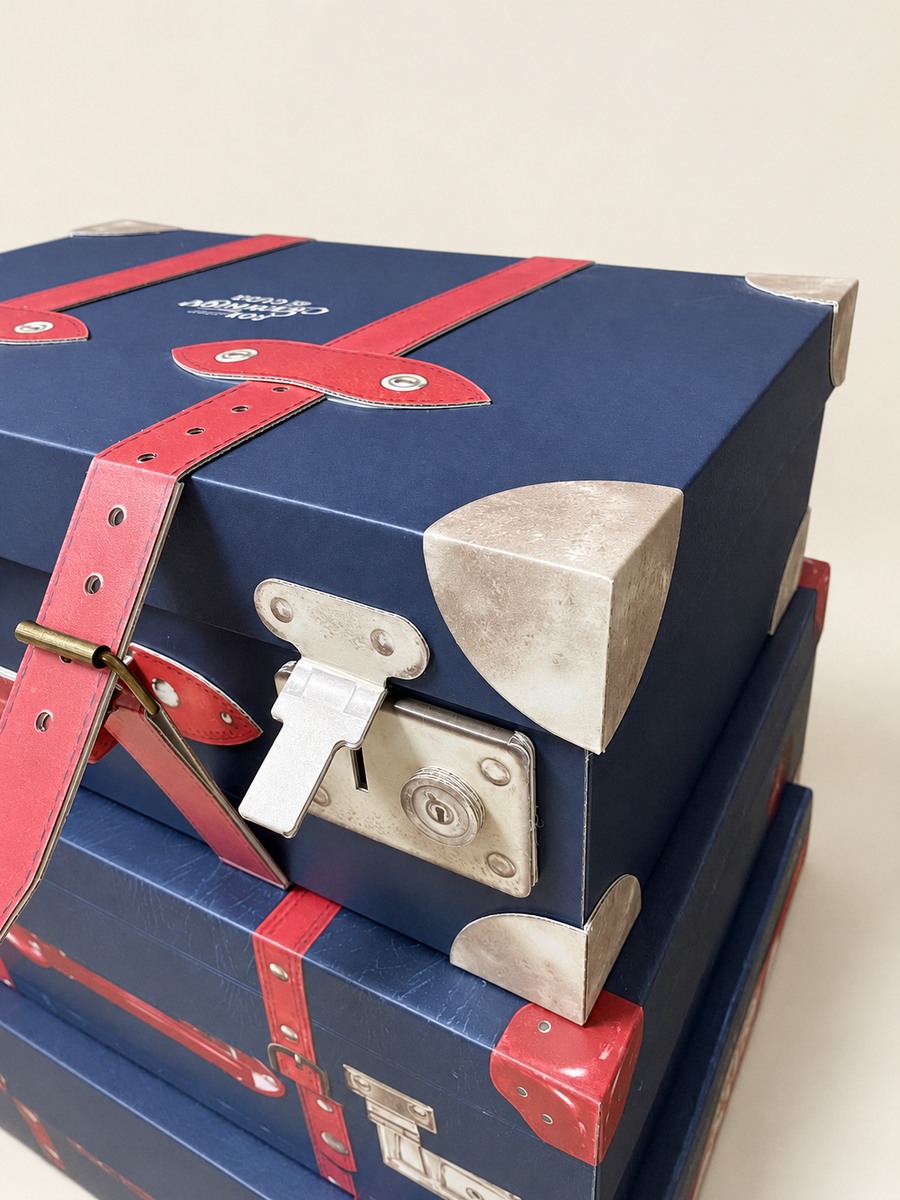 Don Papa suitcase-shaped display with printed straps and corner details