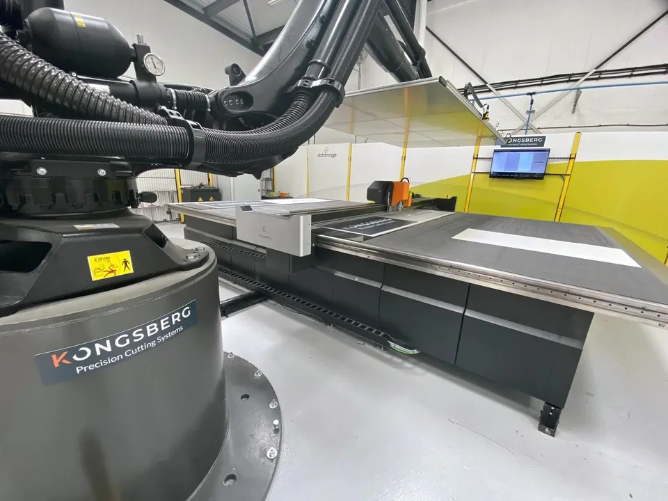 Automated handling alongside production cutting equipment
