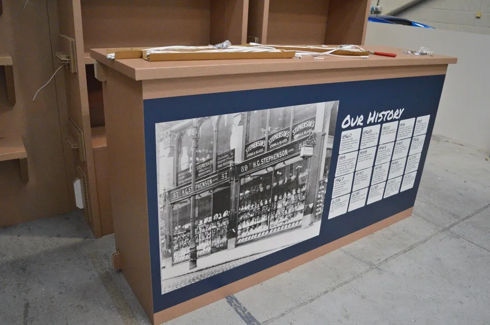 Stephensons shelving, printed headers and stand components