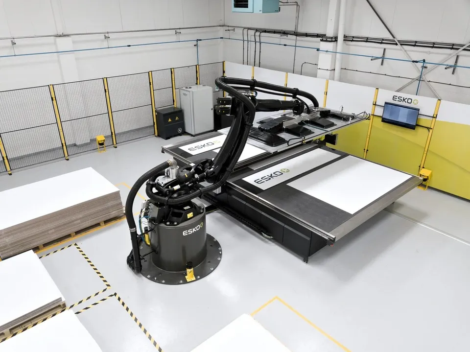 Robotic sheet handling viewed across the cutting table