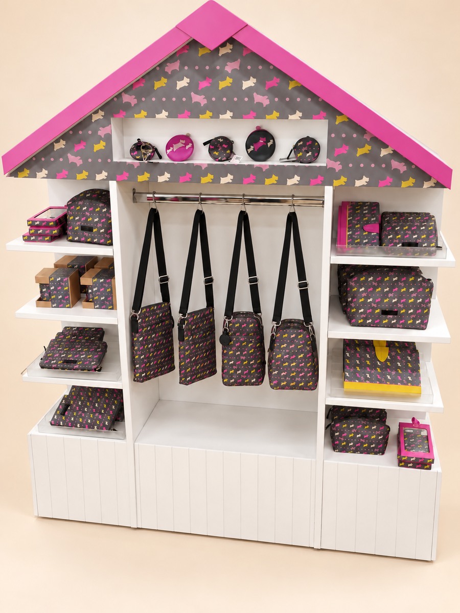 Radley house-shaped display with bags and accessories