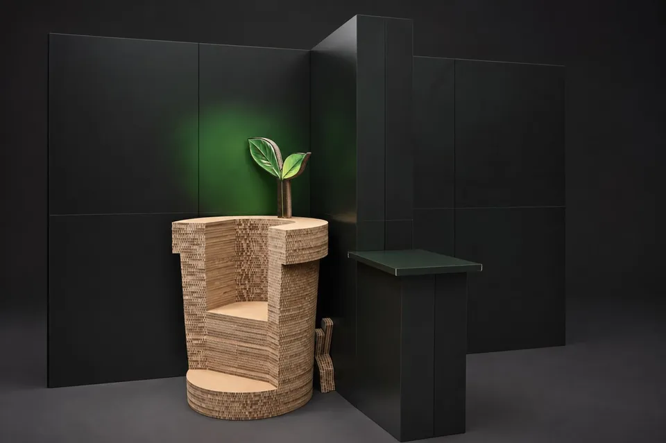 Sculptural chair made from layered board with a decorative leaf