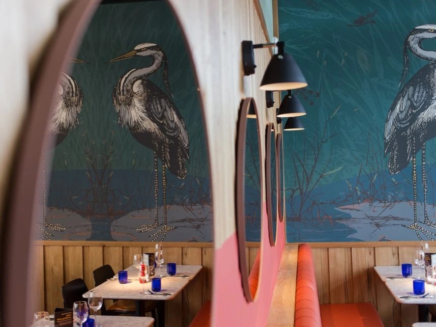 PizzaExpress illustrated heron wall graphics and restaurant setting