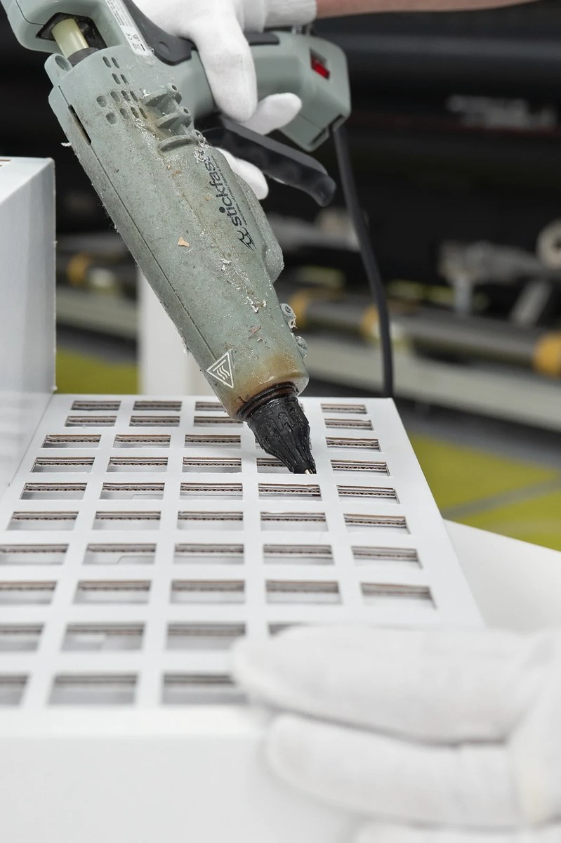 Robotic production working across a precision-cut sheet